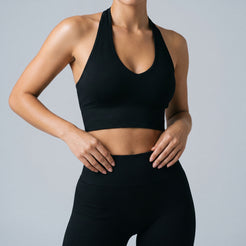 Ascend seamless halter sports bra in black front view