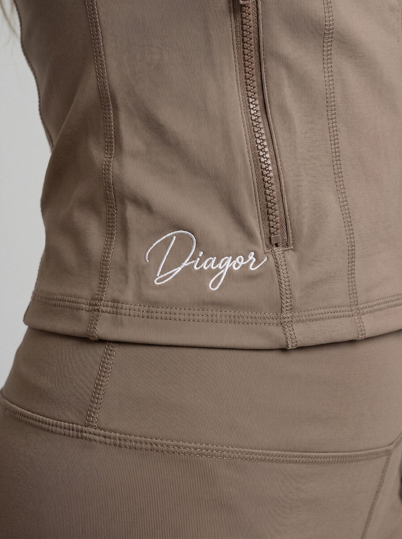 Close up of Charge women’s full zip jacket in cocoa