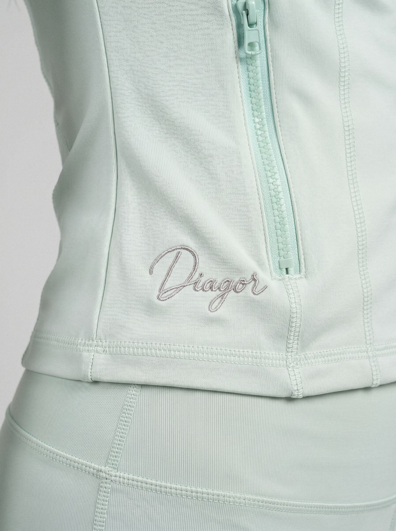 Close up of Charge women’s full zip jacket in mint
