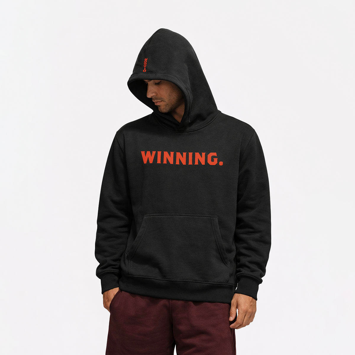 Model wearing WINNING Oversized Performance Hoodie in black